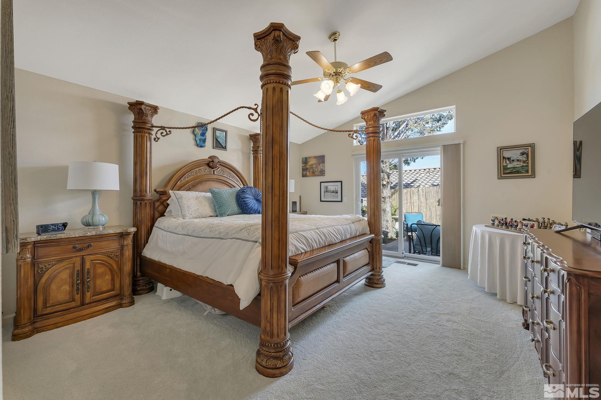 2560 Granite Springs Road Reno, NV 89519 - Photo 15 of 33 a bedroom with a bed and a chandelier