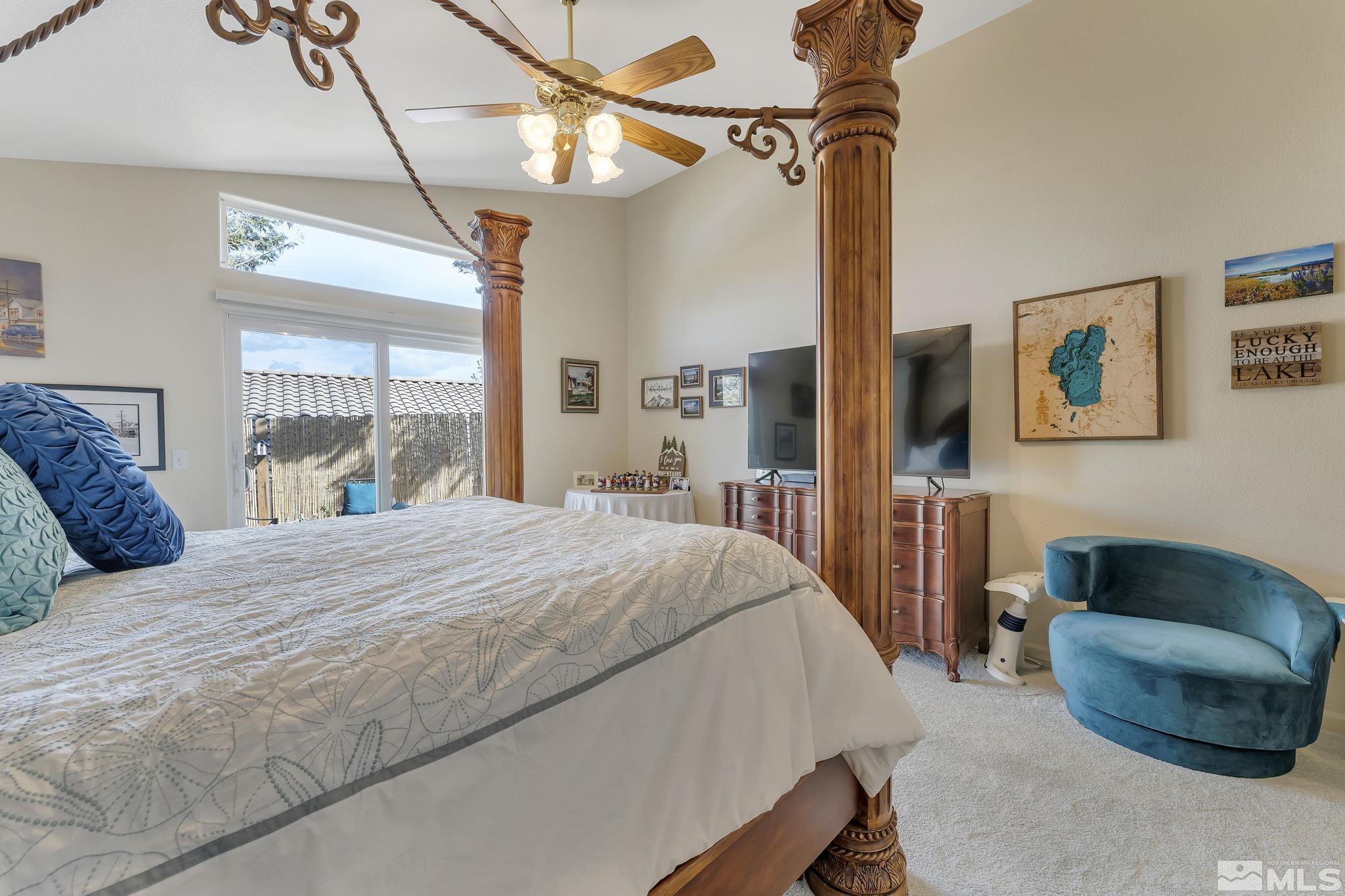 2560 Granite Springs Road Reno, NV 89519 - Photo 16 of 33 a bedroom with a bed couch and a window
