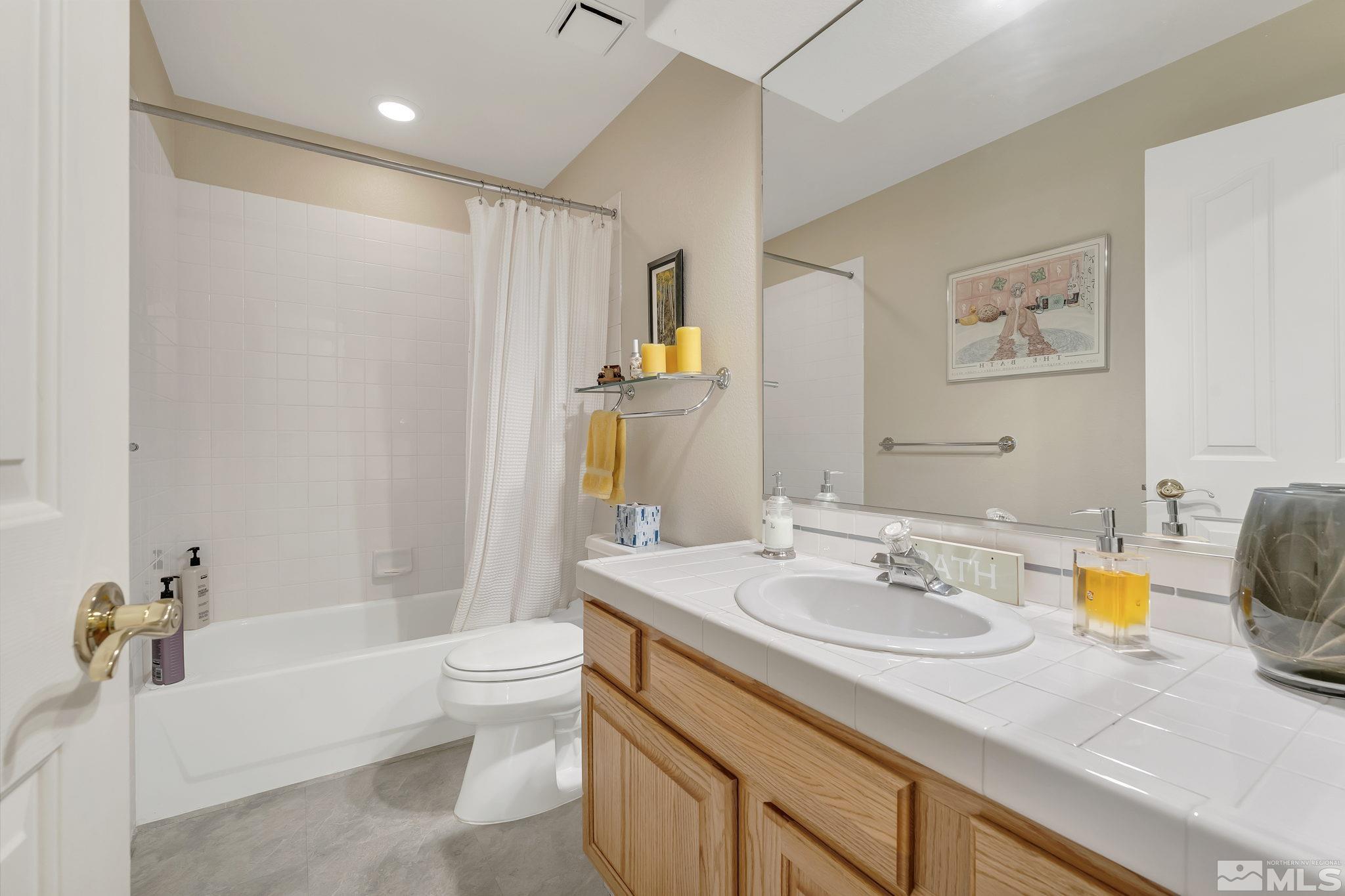 2560 Granite Springs Road Reno, NV 89519 - Photo 24 of 33 a bathroom with a sink a toilet and shower