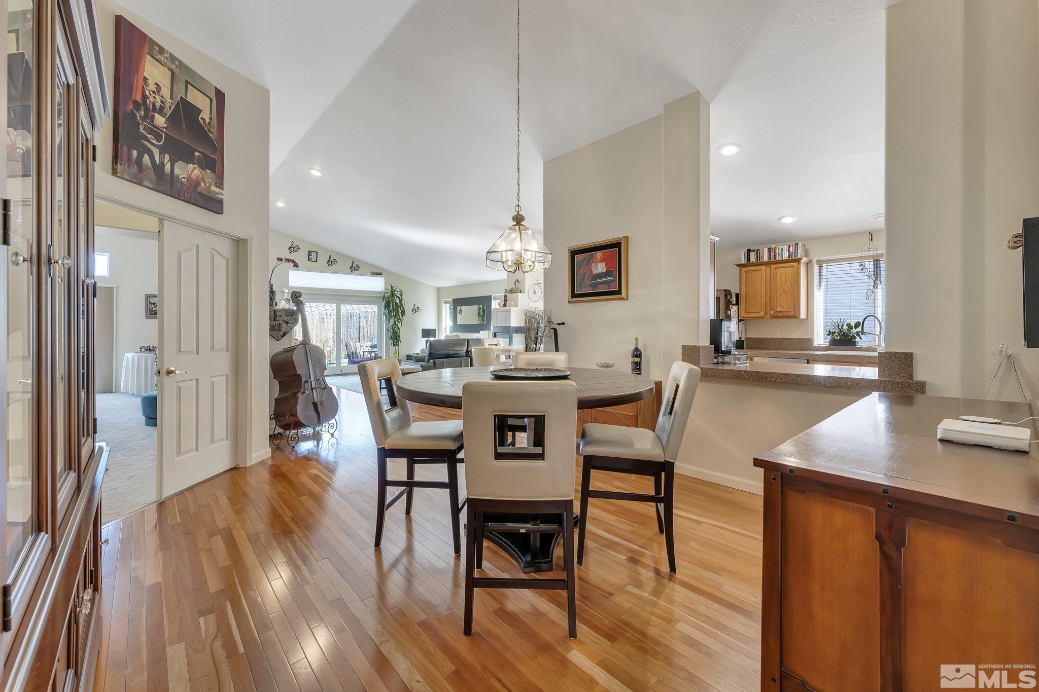 2560 Granite Springs Road Reno, NV 89519 - Photo 5 of 33 a view of a dining room with furniture and wooden floor