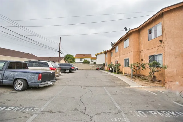 a view of a cars is parked in front of house