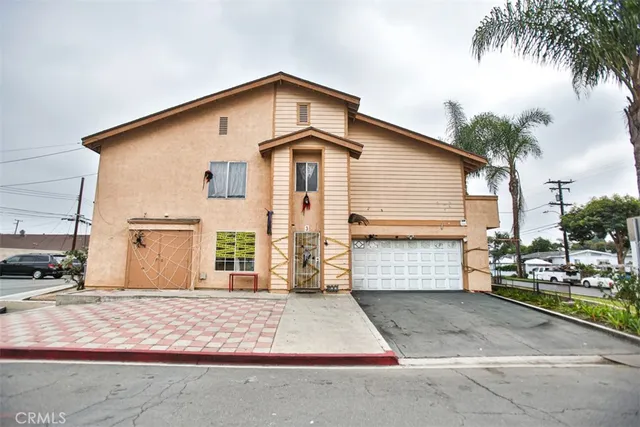 a front view of a house with a garage