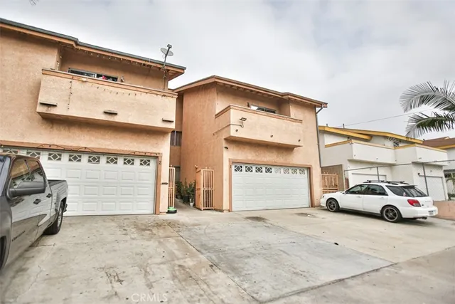 a view of parking car parked in front of building