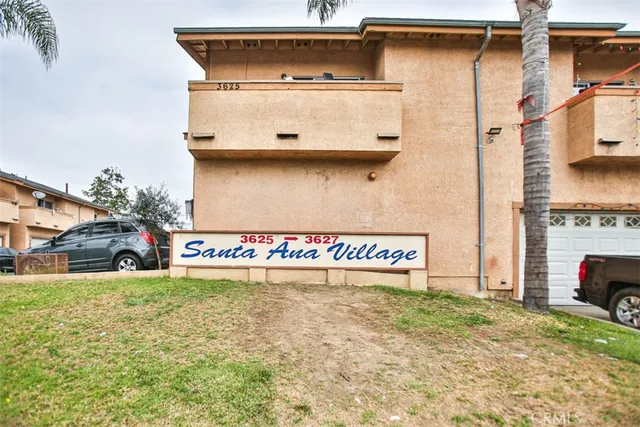 a view of a car park in front of a house