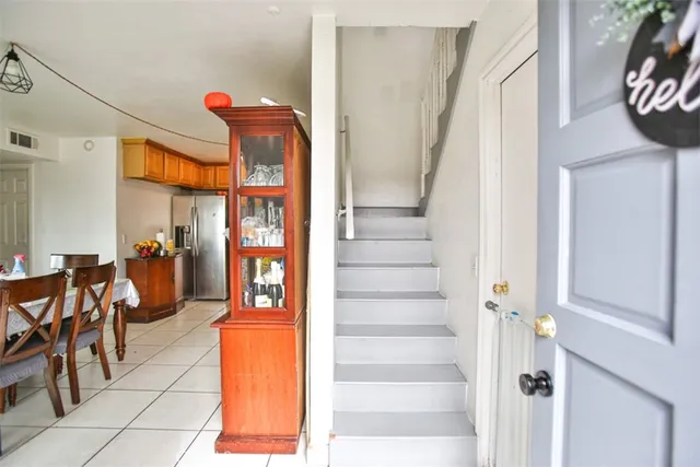 a view of a dining room with furniture and a kitchen