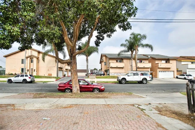 a view of a street with cars on road