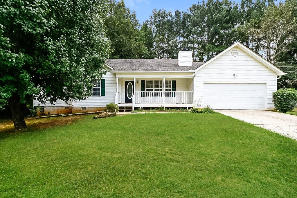235 Nicki Court Hampton, GA 30228 - Photo 1 of 1 a view of a house with a backyard and a patio