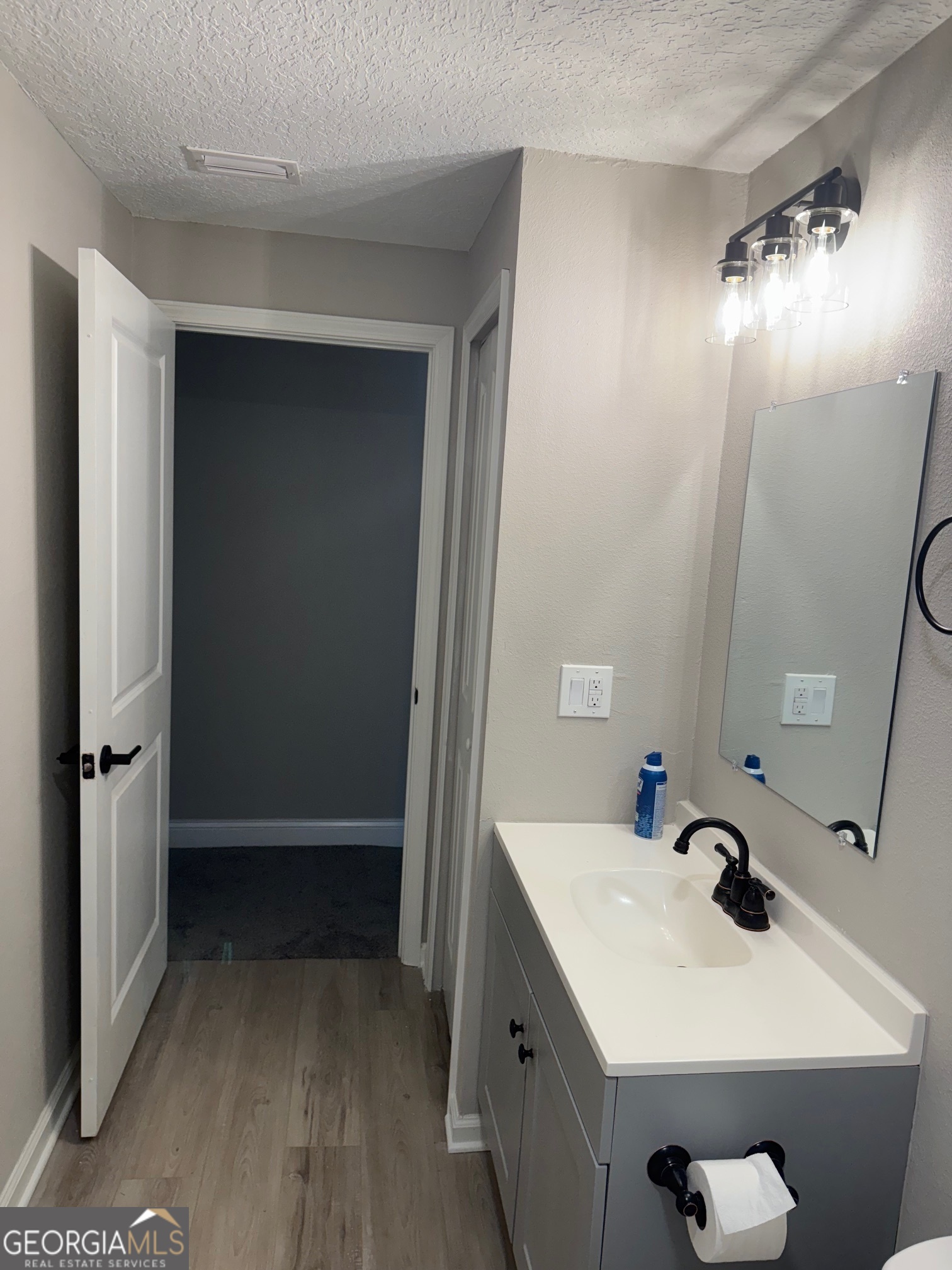 2199 Tom Crawford Road Hilliard, FL 32046 - Photo 15 of 18 a bathroom with a sink and mirror