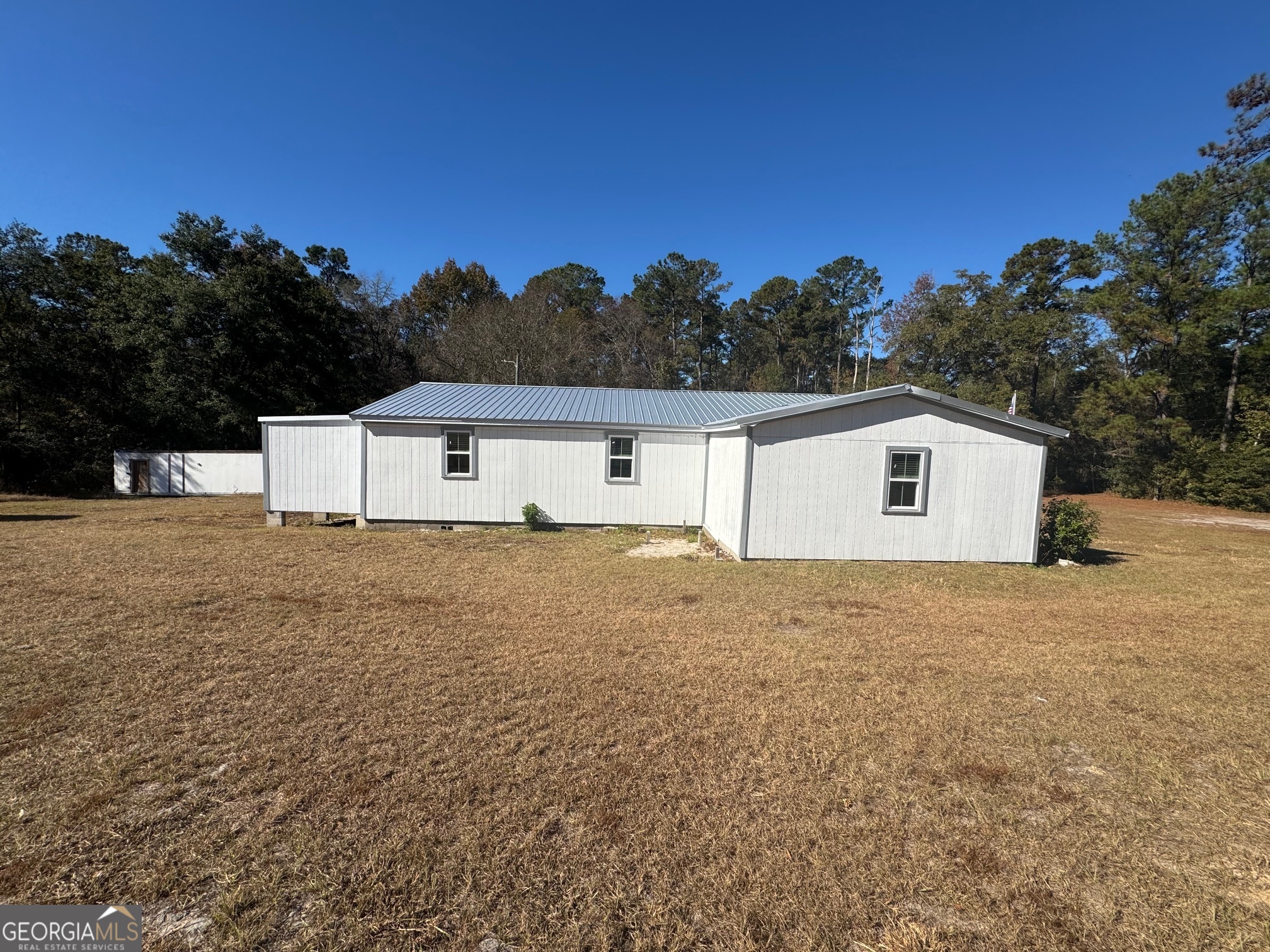 2199 Tom Crawford Road Hilliard, FL 32046 - Photo 16 of 18 a house view with a backyard space