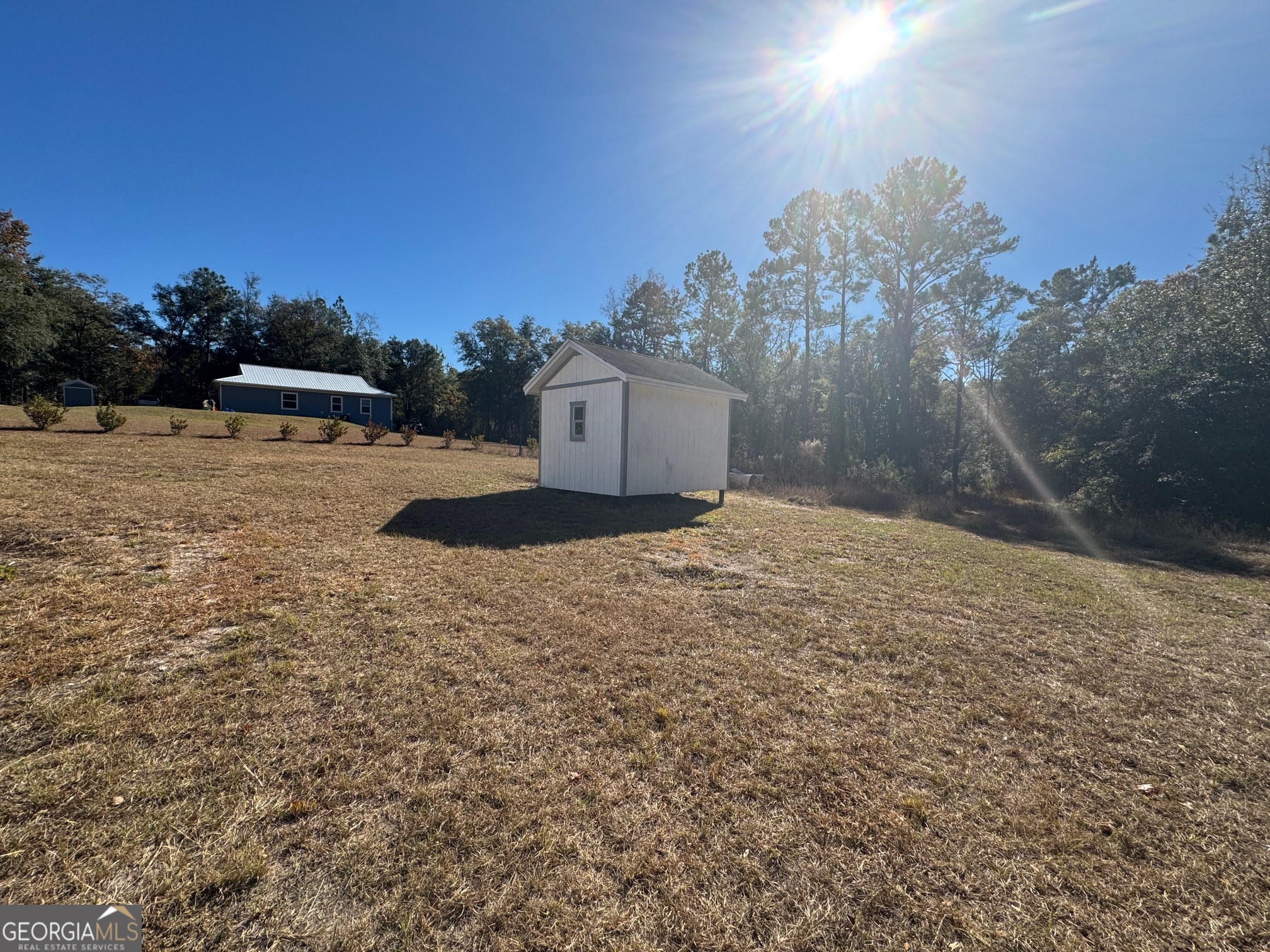 2199 Tom Crawford Road Hilliard, FL 32046 - Photo 17 of 18 a view of a house with a yard