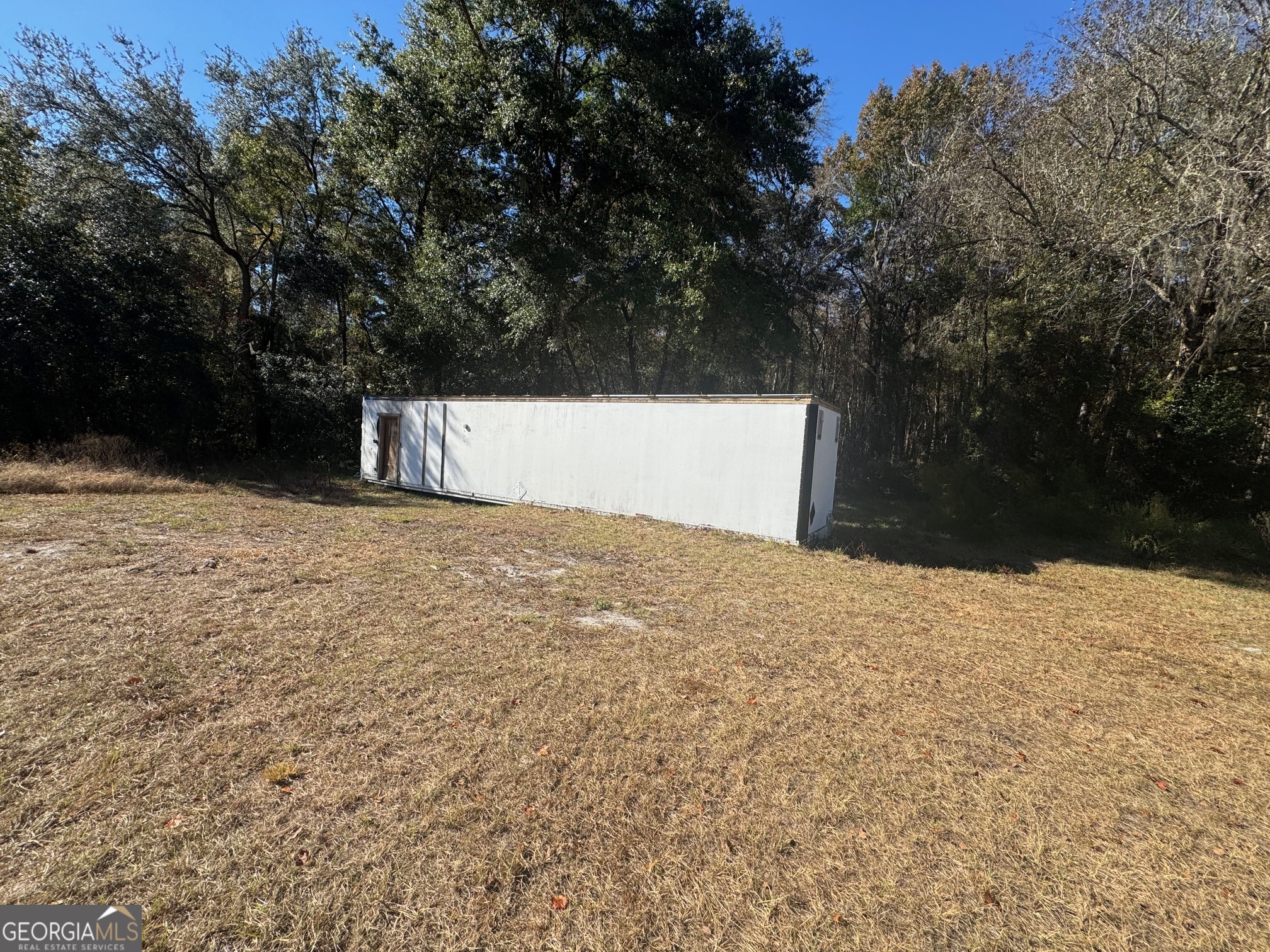 2199 Tom Crawford Road Hilliard, FL 32046 - Photo 18 of 18 a view of a backyard of the house