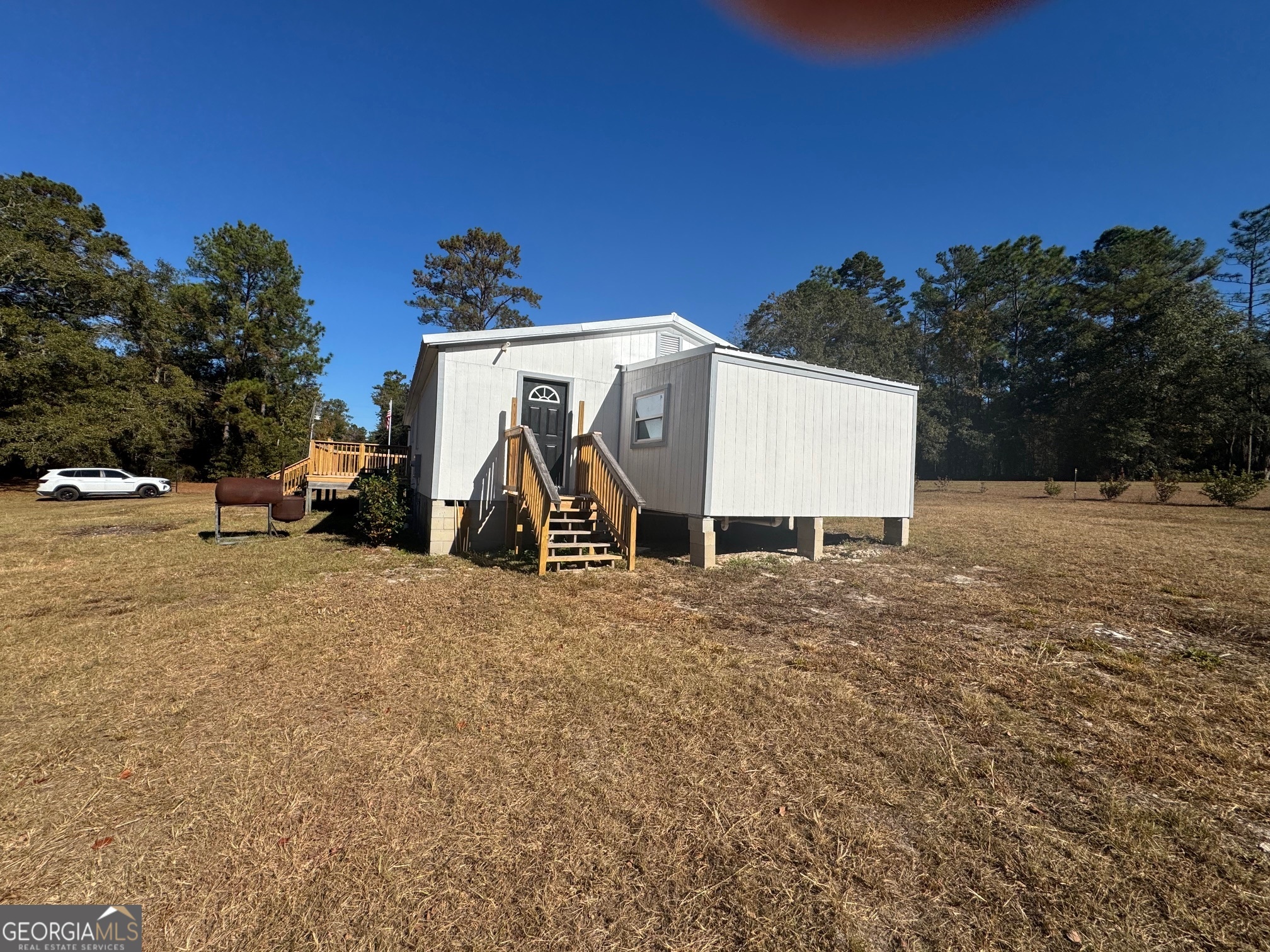 2199 Tom Crawford Road Hilliard, FL 32046 - Photo 5 of 18 a view of a house with a yard