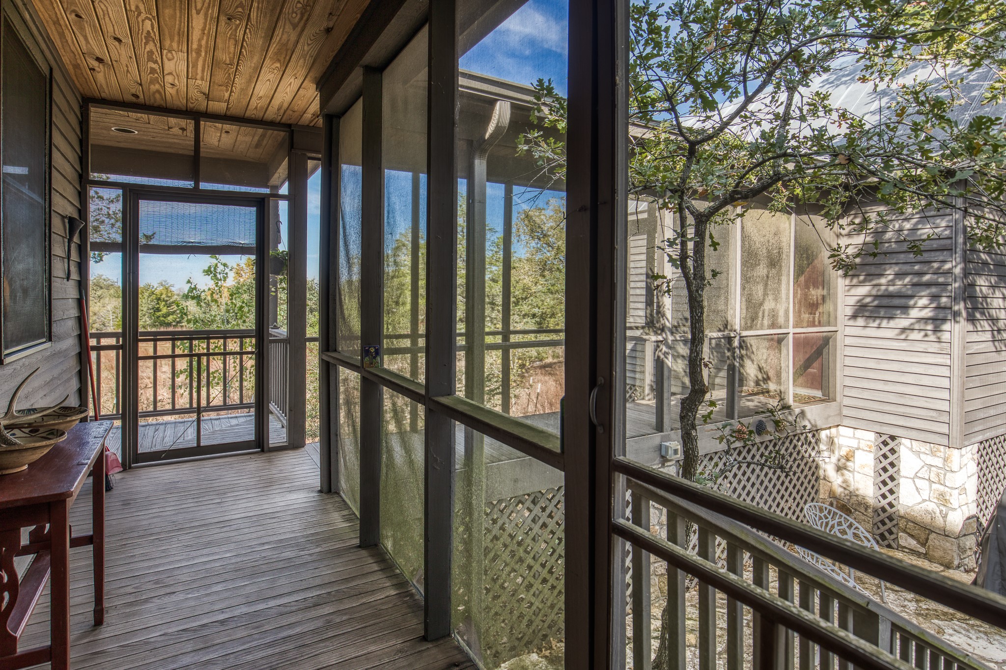 1745 Schoenberg Road Carmine, TX 78932 - Photo 16 of 30 a view of a balcony with wooden floor and floor to ceiling window wooden floor and fence