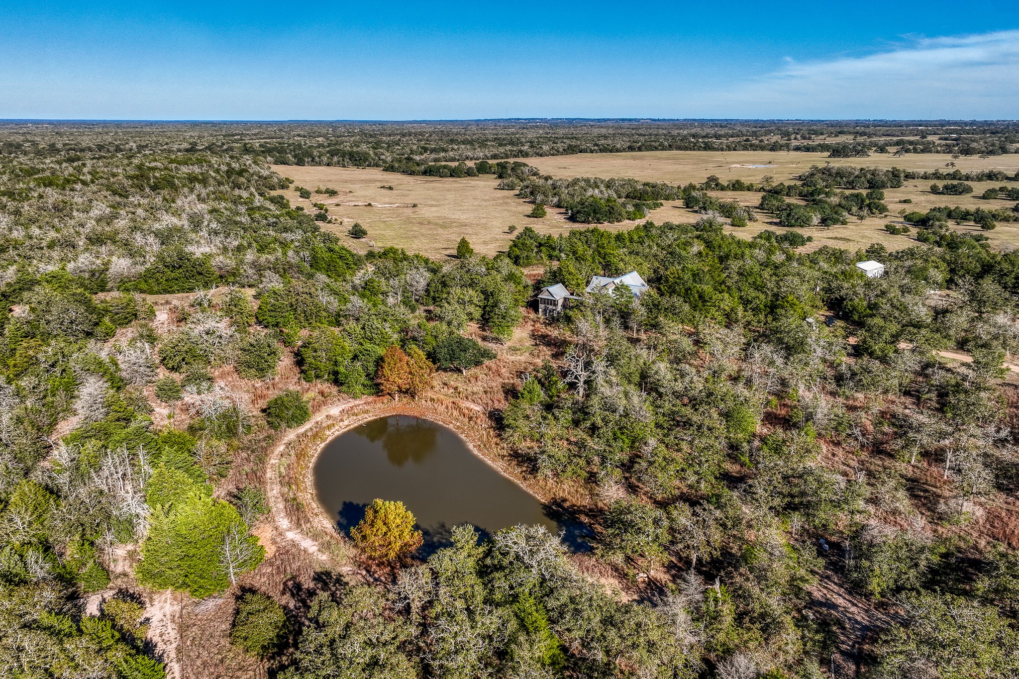 1745 Schoenberg Road Carmine, TX 78932 - Photo 29 of 30 an aerial view of a house with a yard and lake view