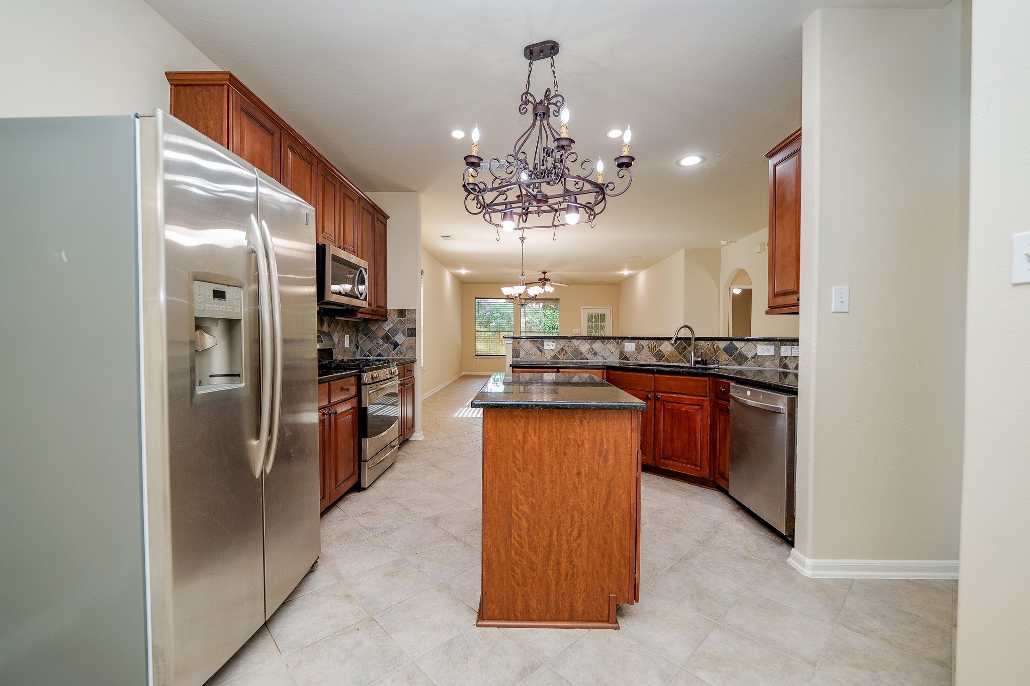 20127 Jasper Oaks Drive Cypress, TX 77433 - Photo 14 of 32 a kitchen with stainless steel appliances granite countertop a refrigerator and a sink
