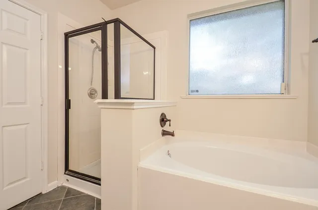 a bathroom with a sink a mirror and shower