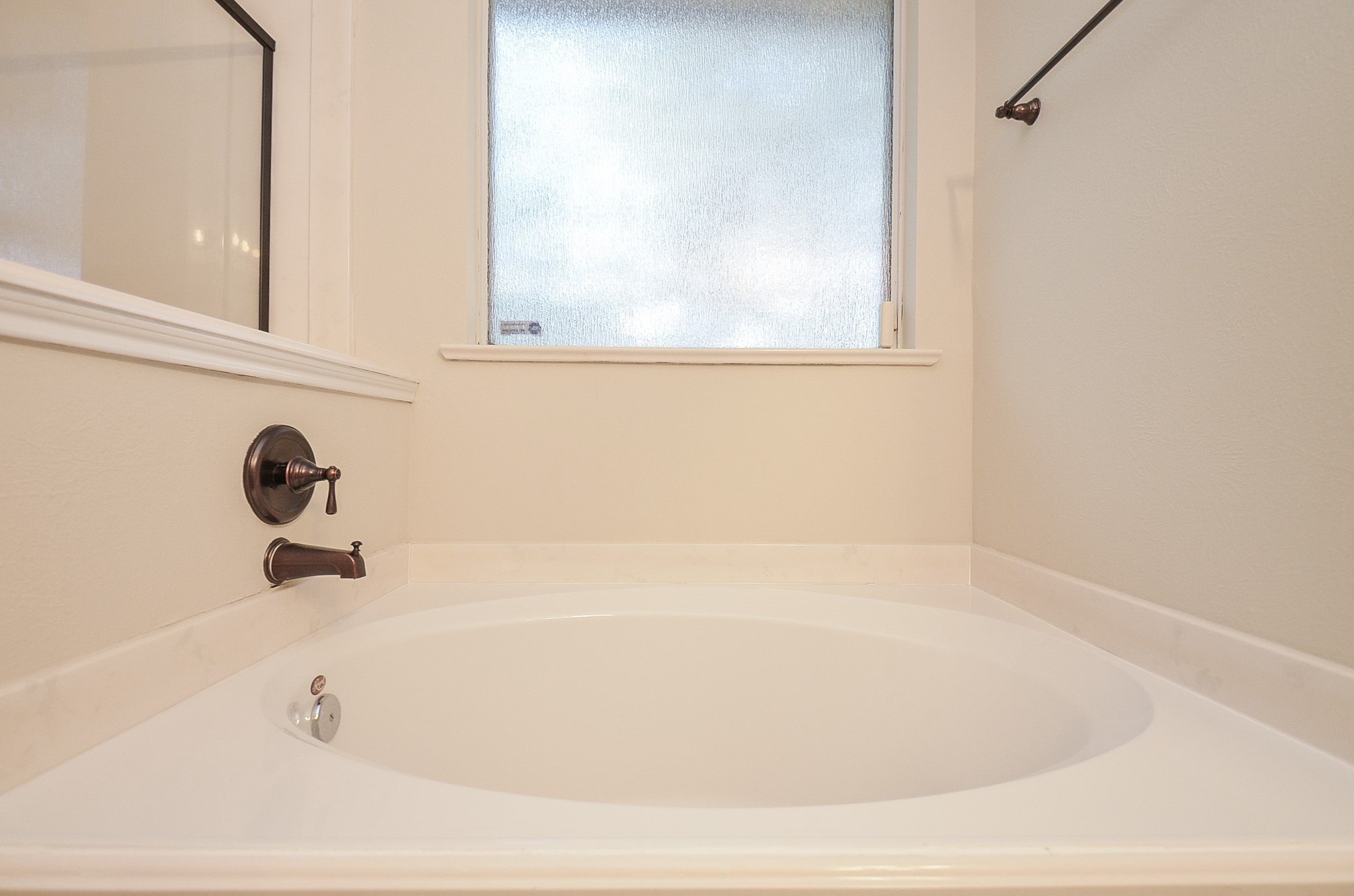 20127 Jasper Oaks Drive Cypress, TX 77433 - Photo 20 of 32 a white bath tub sitting next to a window