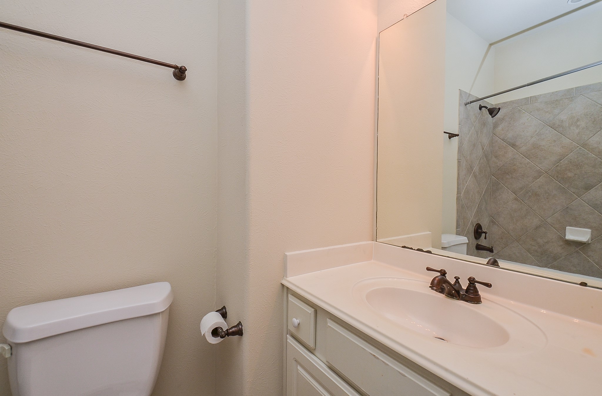 20127 Jasper Oaks Drive Cypress, TX 77433 - Photo 23 of 32 a bathroom with a sink and a toilet