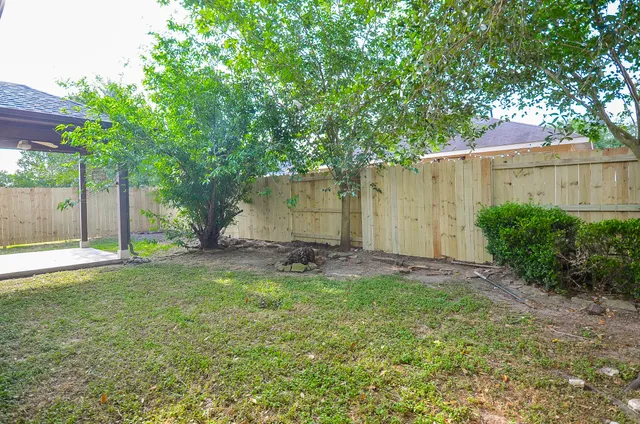 a house that has a tree in front of the house