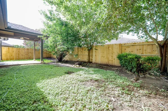 a view of backyard with green space