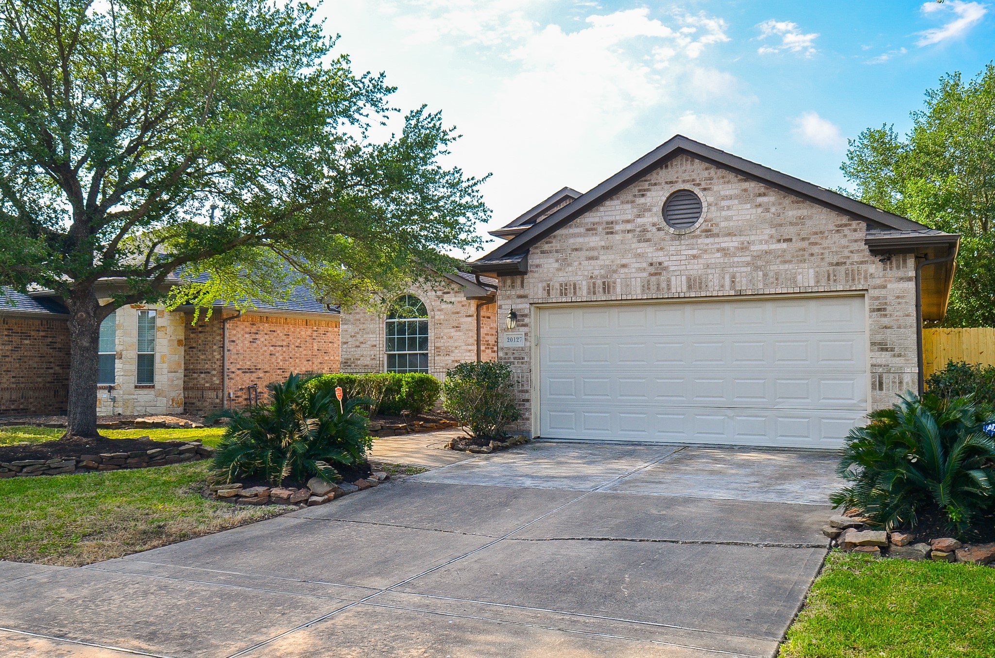20127 Jasper Oaks Drive Cypress, TX 77433 - Photo 4 of 32 a house view with a garden space