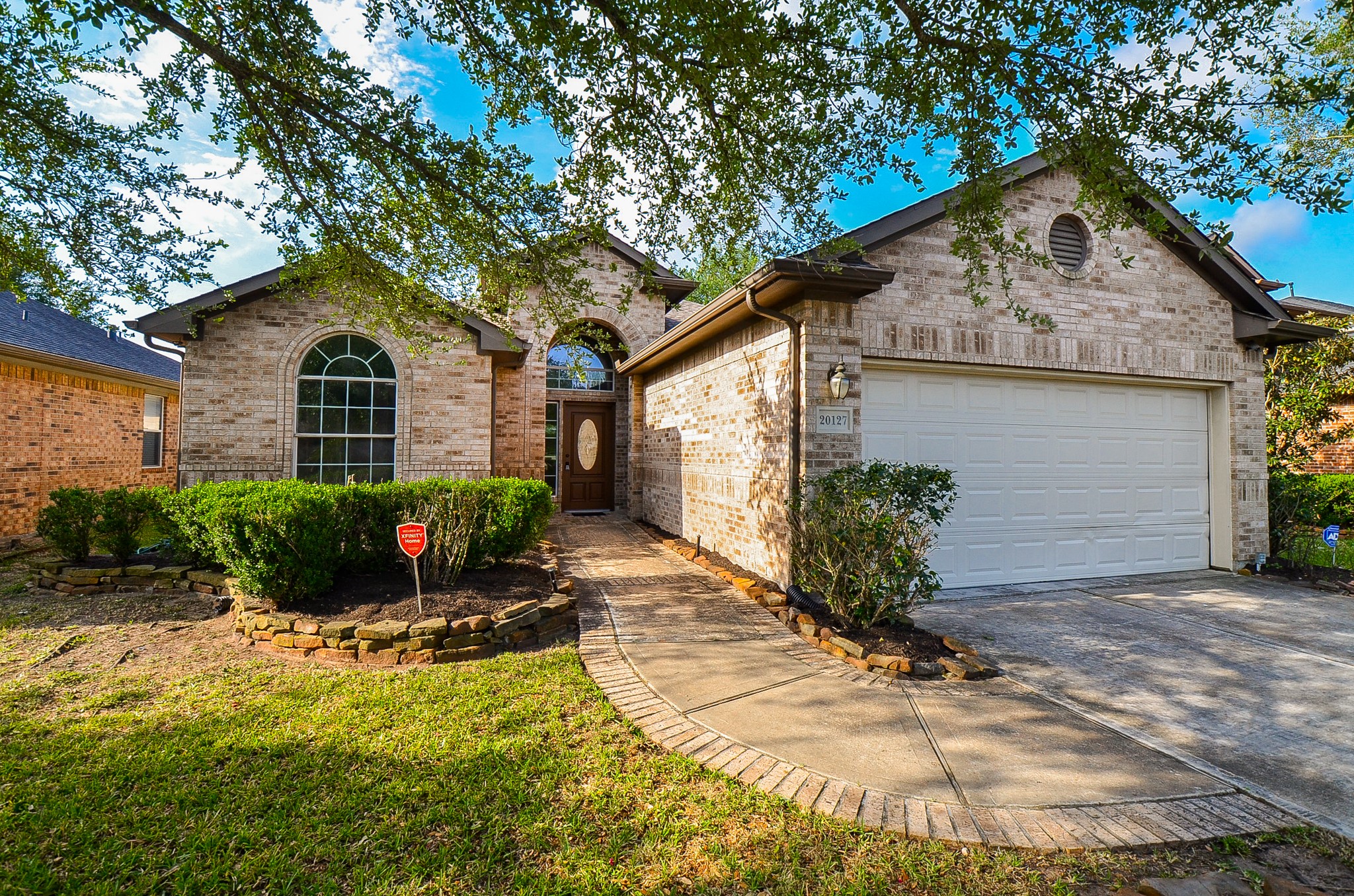 20127 Jasper Oaks Drive Cypress, TX 77433 - Photo 5 of 32 a front view of a house with a yard