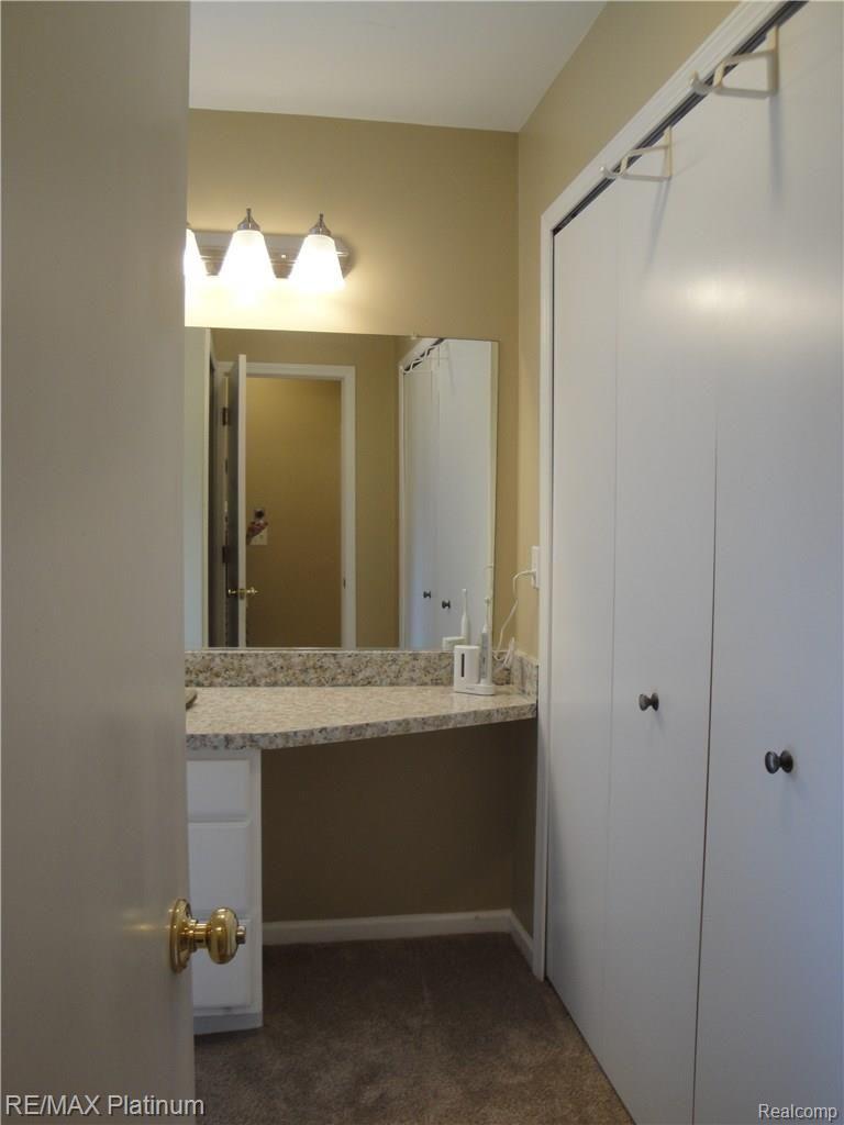 1201 Oakcrest Road Howell, MI 48843 - Photo 30 of 57 Vanity area in end room #1