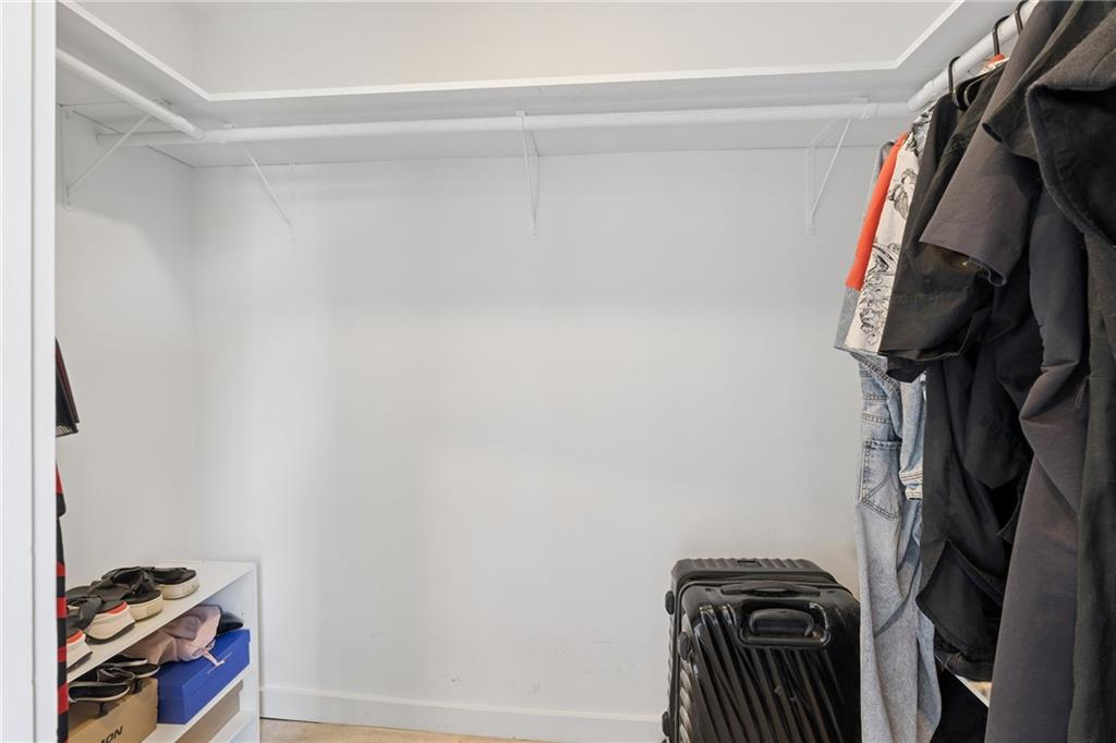 752 Moreland Avenue Southeast, Unit 4 Atlanta, GA 30316 - Photo 33 of 58 a view of walk in closet with clothes and shoes