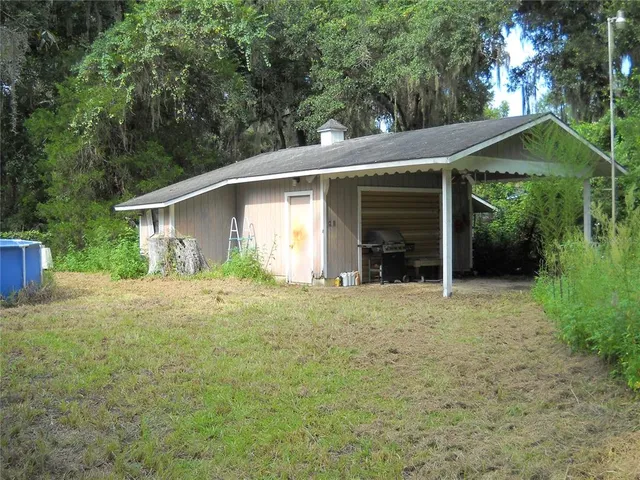 a house with trees in the background