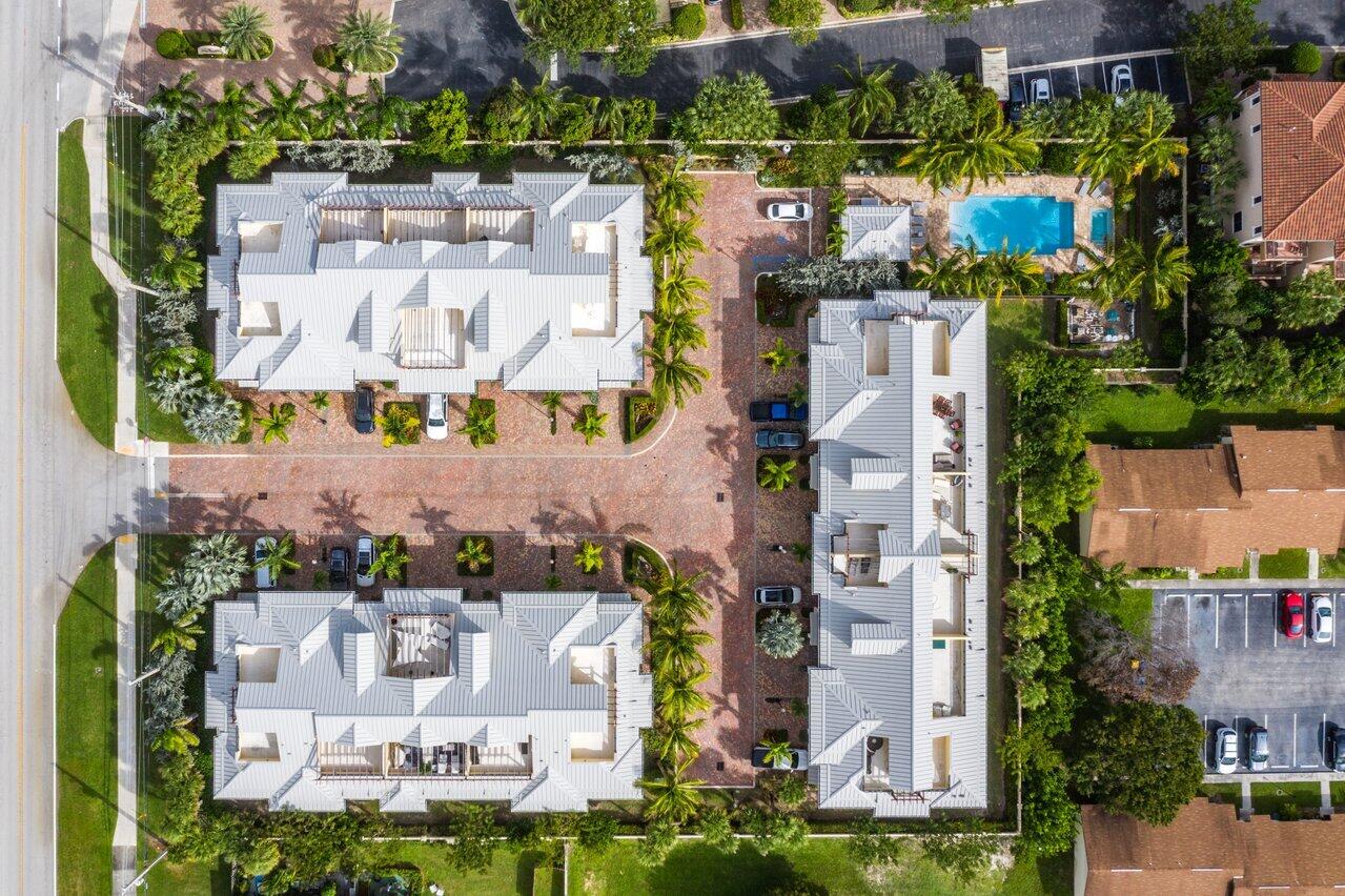 an aerial view of houses with outdoor space