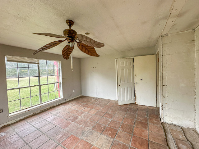 620 Sundown Road Caldwell, TX 77836 - Photo 11 of 15 a view of empty room with wooden floor and fan