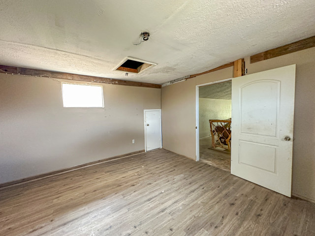 620 Sundown Road Caldwell, TX 77836 - Photo 12 of 15 a view of empty room with wooden floor