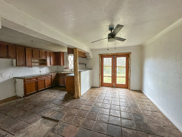 620 Sundown Road Caldwell, TX 77836 - Photo 7 of 15 a kitchen with stainless steel appliances granite countertop a stove sink and cabinets