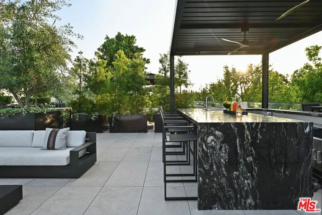 a view of a terrace with furniture