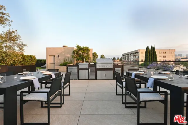 a outdoor living space with furniture and garden view