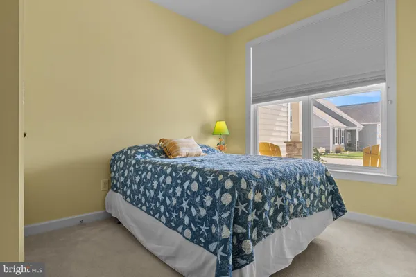 a bedroom with a bed and lamps
