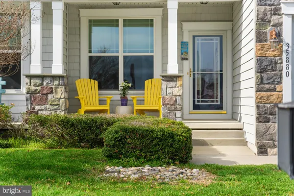 a view of front door of house with yard