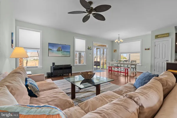 a living room with furniture and a lamp