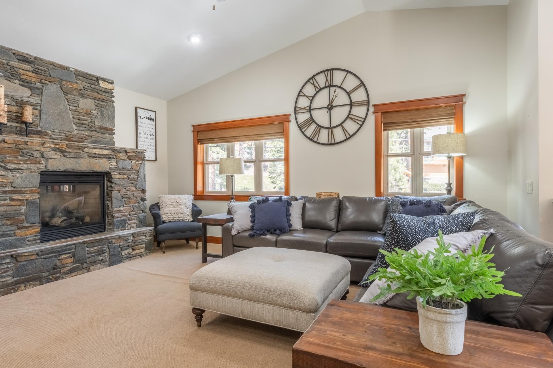 125 Davison Road, Unit 1 Mammoth Lakes, CA 93546 - Photo 13 of 46 a living room with furniture a fireplace and a potted plant