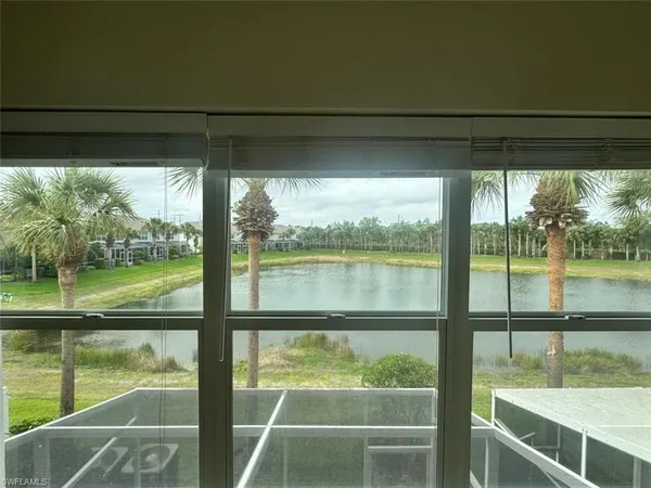 a bathroom with a shower and a glass door