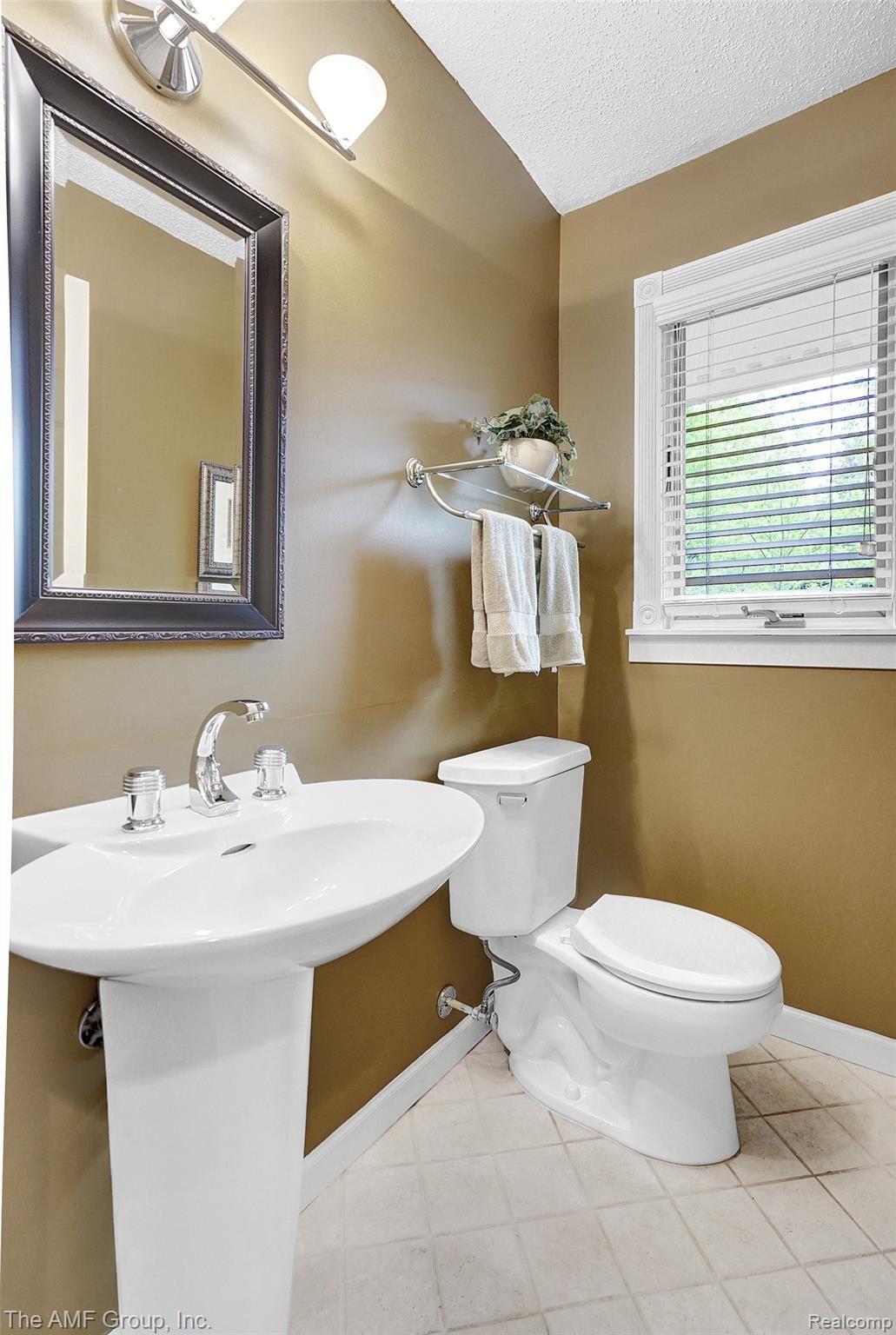 2695 Dutton Road Rochester, MI 48306 - Photo 28 of 41 Half bath off of kitchen and right by 5.5 car garage!