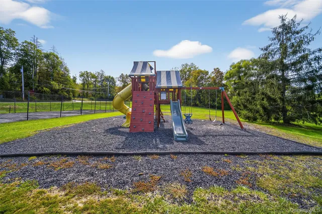 a view of an outdoor space and tennis court