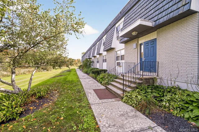 a view of a pathway both side of the house