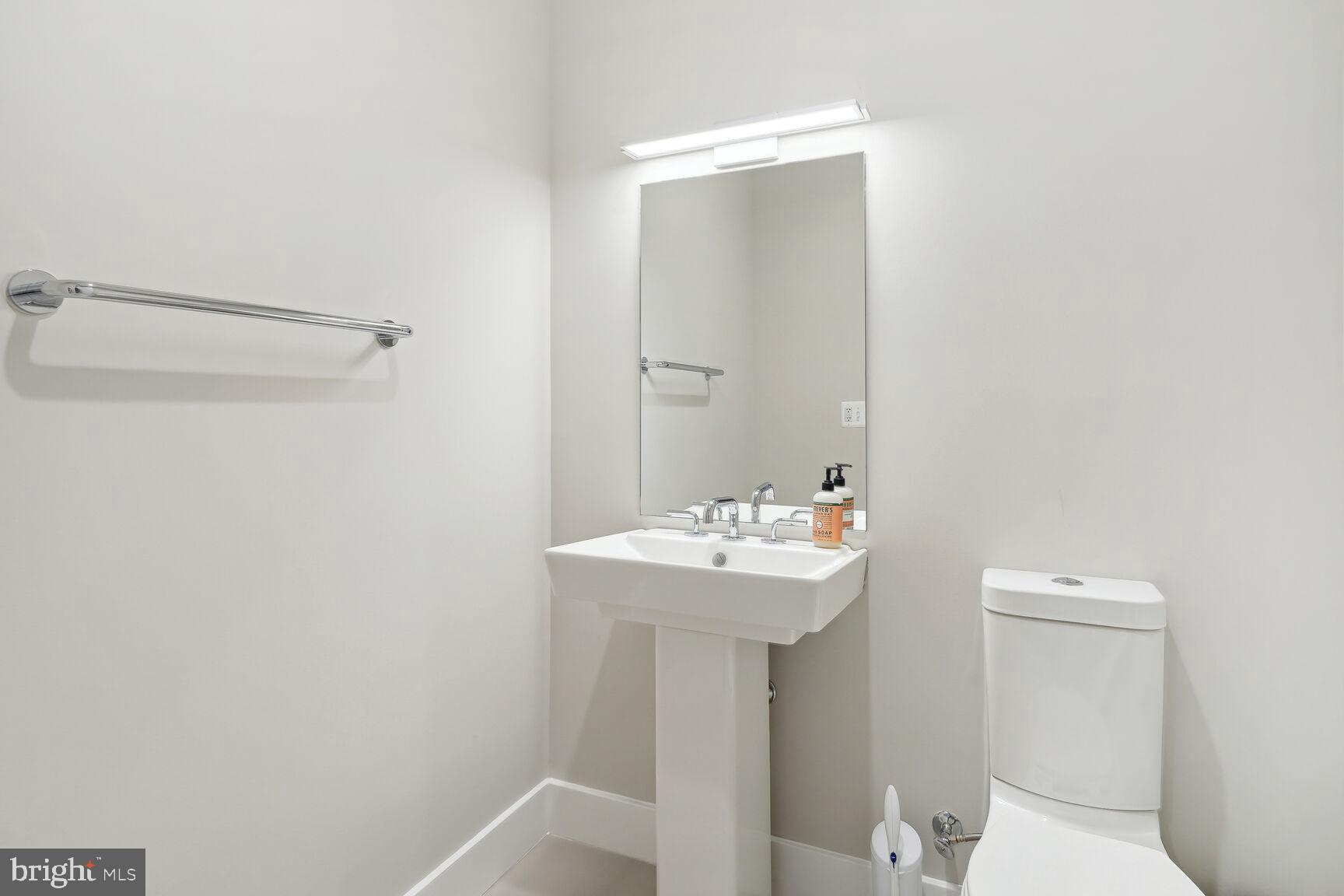 1628 11th Street Northwest, Unit 108 Washington, DC 20001 - Photo 11 of 44 a bathroom with a sink a toilet and shower