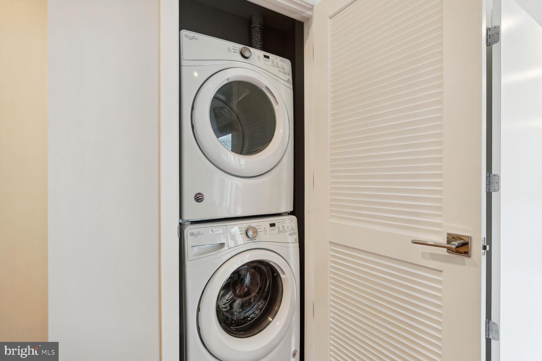 1628 11th Street Northwest, Unit 108 Washington, DC 20001 - Photo 17 of 44 a view of a hallway with washer and dryer