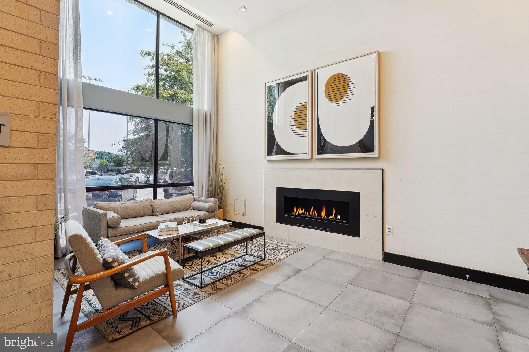 1628 11th Street Northwest, Unit 108 Washington, DC 20001 - Photo 2 of 44 a living room with furniture a fireplace and a window