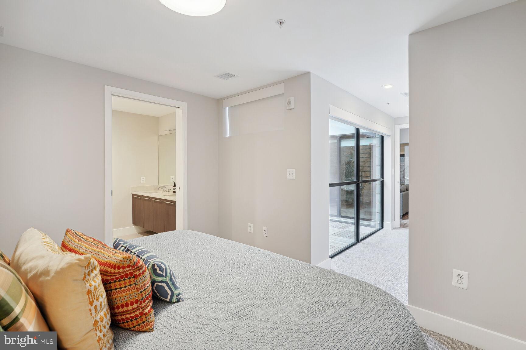 1628 11th Street Northwest, Unit 108 Washington, DC 20001 - Photo 22 of 44 a bedroom with a bed and a window