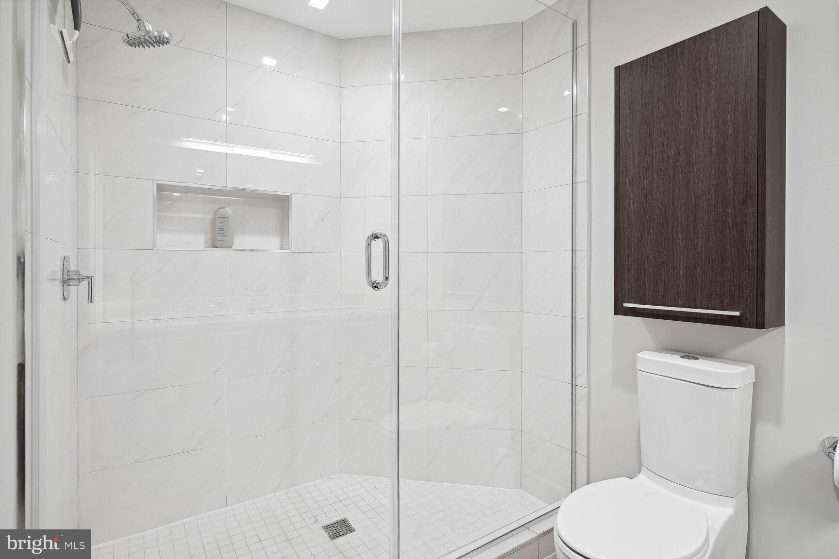 1628 11th Street Northwest, Unit 108 Washington, DC 20001 - Photo 26 of 44 a bathroom with a toilet and a shower