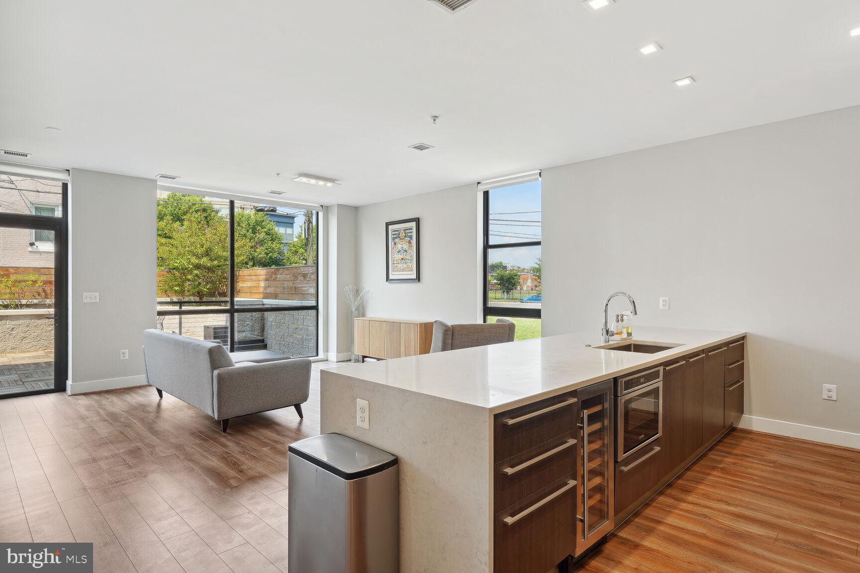 1628 11th Street Northwest, Unit 108 Washington, DC 20001 - Photo 4 of 44 a kitchen with a sink and large window