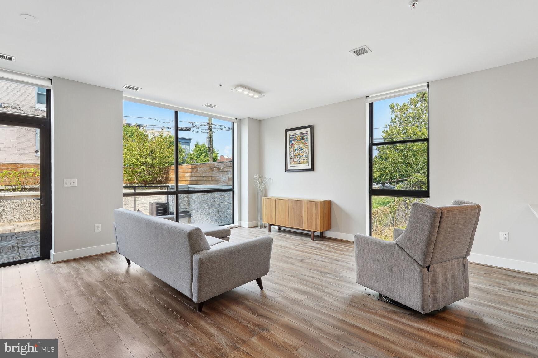 1628 11th Street Northwest, Unit 108 Washington, DC 20001 - Photo 5 of 44 a living room with furniture and a large window